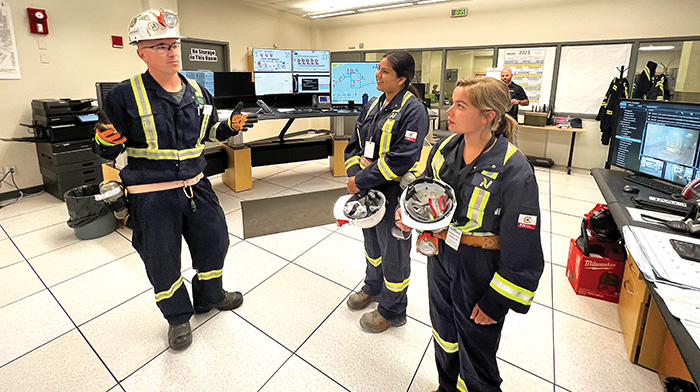 Nutrien Rocanville mine site General Manager Justin Young explaining how the mine works to Sierra D’Souza Butts and Sunnette Kamffer of the World-Spectator.